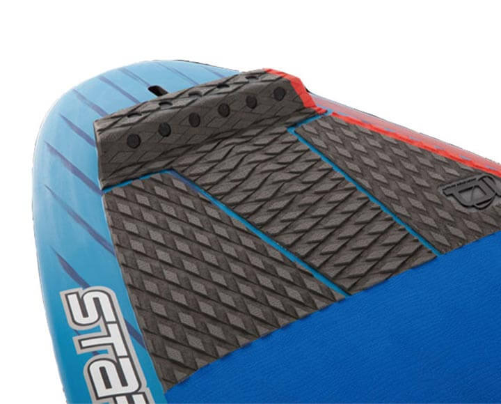 Black surf traction pad in use on surfboard