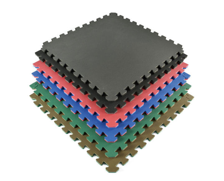 foam puzzle mats piled up in various colors